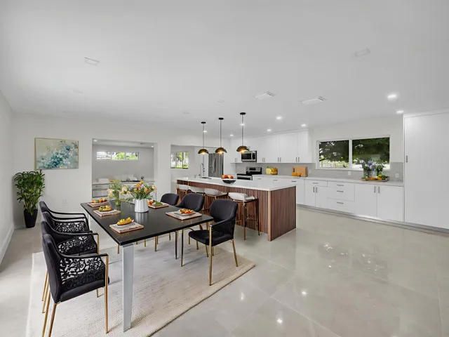 a kitchen with a table and chairs in it