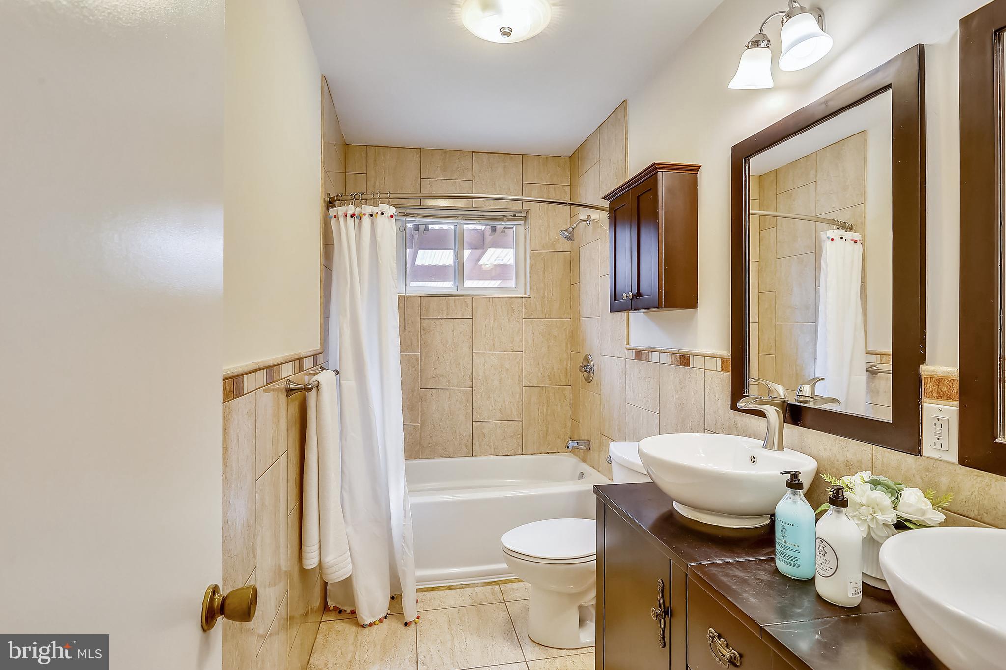 6218 Rockhurst Road Bethesda, MD 20817 - Photo 22 of 33 Hallway full bath with double sink.