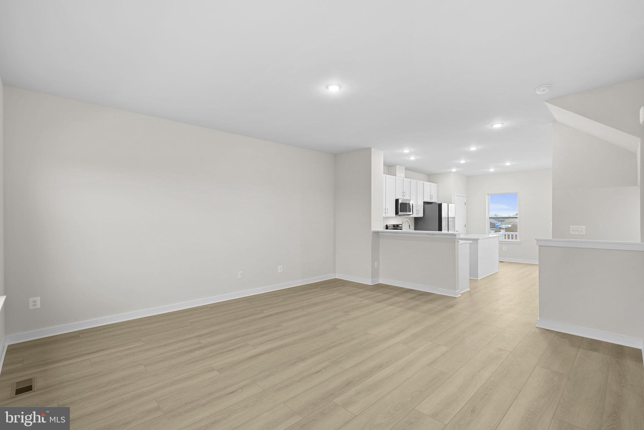 2233 Sherman Avenue Ranson, WV 25438 - Photo 13 of 50 a view of kitchen with kitchen island and wooden floor