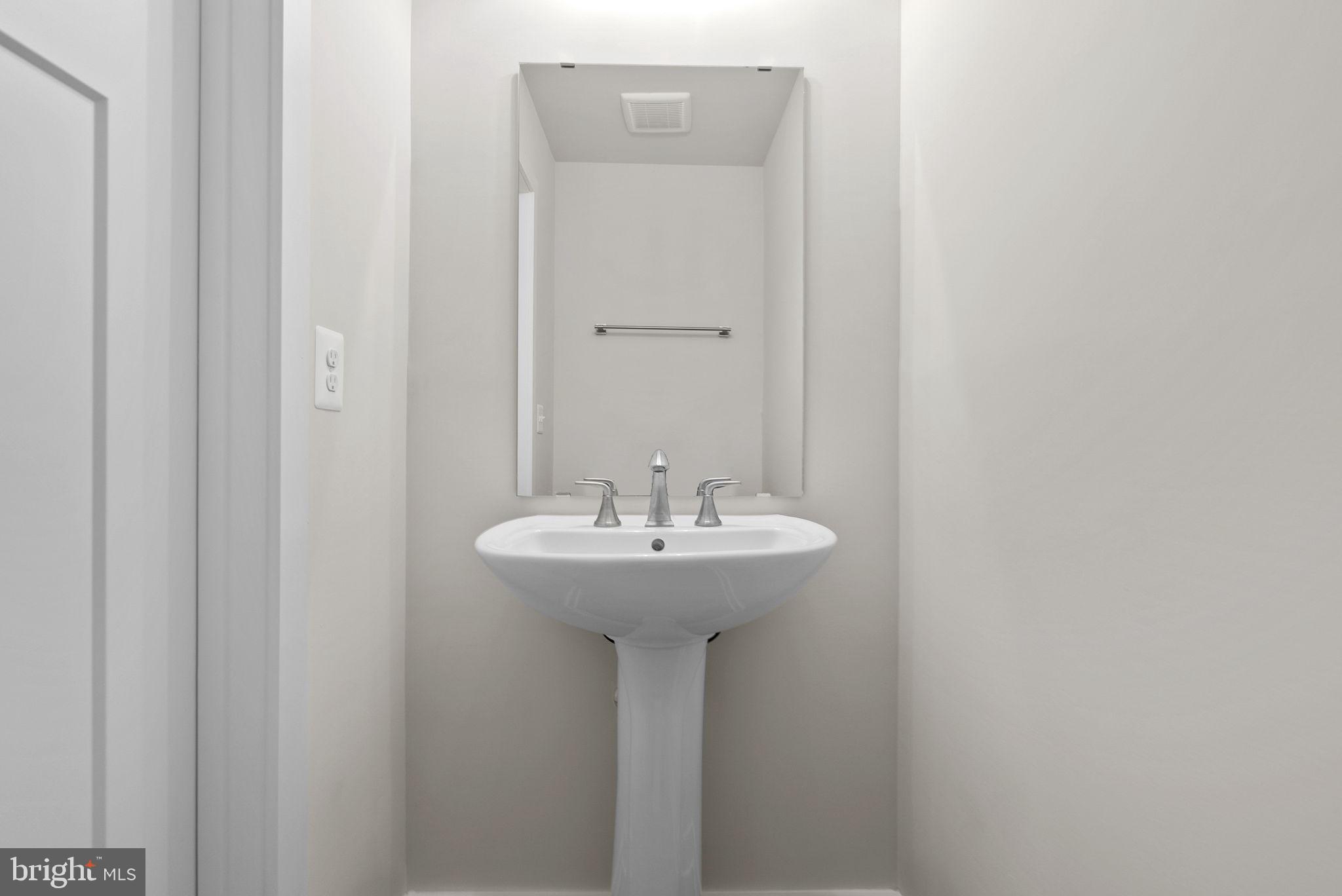 2233 Sherman Avenue Ranson, WV 25438 - Photo 25 of 50 a bathroom with a sink and a mirror