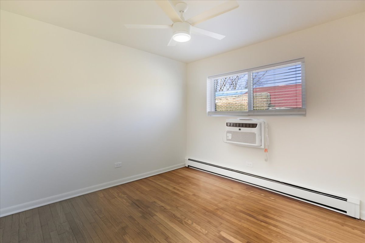 7357 North Winchester Avenue, Unit 2M Chicago, IL 60626 - Photo 8 of 10 wooden floor in an empty room