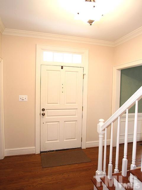 10424 Whitestone Road Raleigh, NC 27615 - Photo 2 of 25 Family room is open to the sunroom, check out the updated stonework on the fireplace surround.