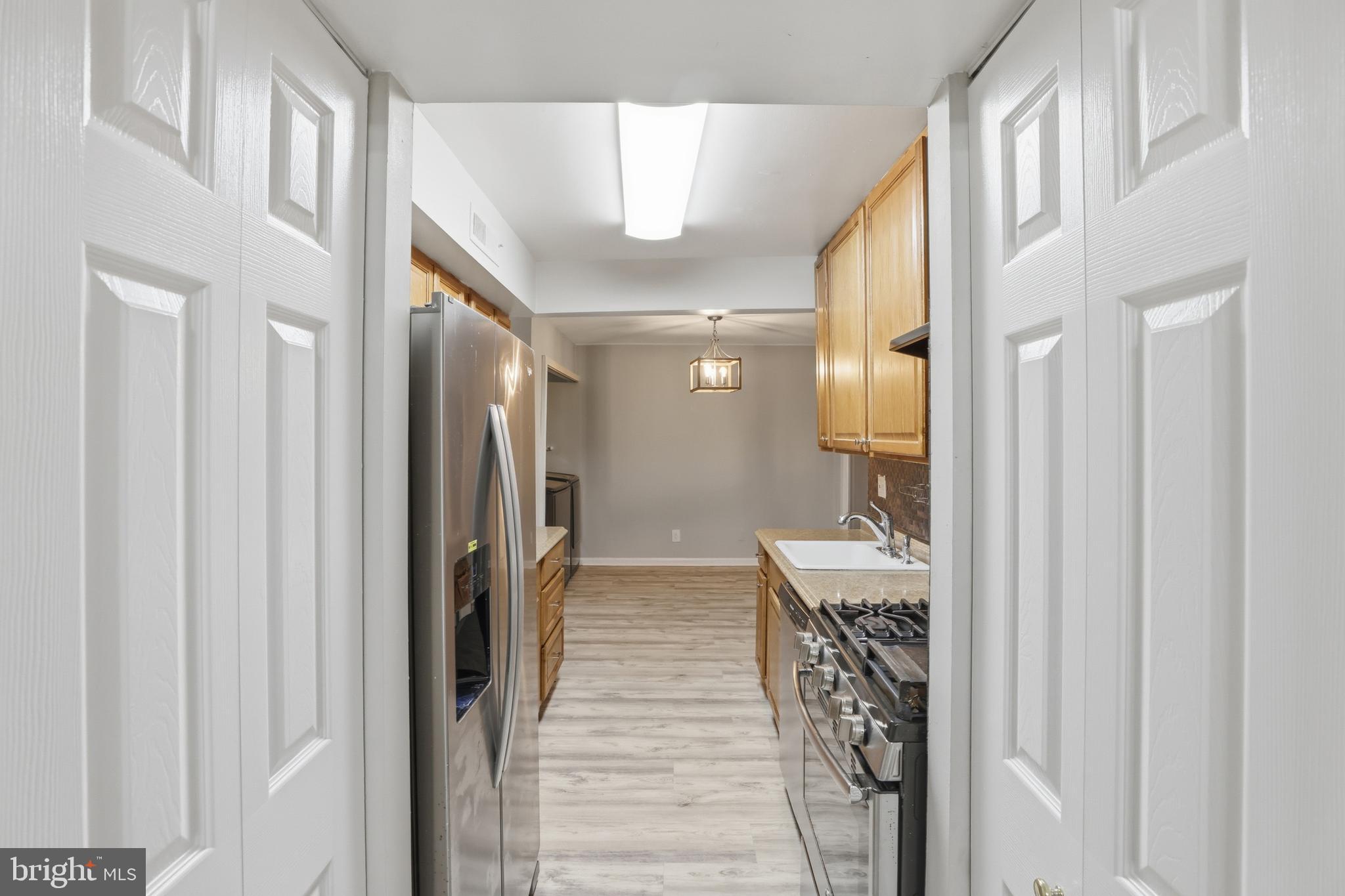 11242 Cherry Hill Road, Unit 1 Beltsville, MD 20705 - Photo 11 of 31 a bathroom with a mirror and a shower