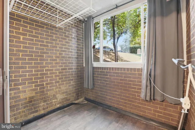 a view of a door and wooden floor