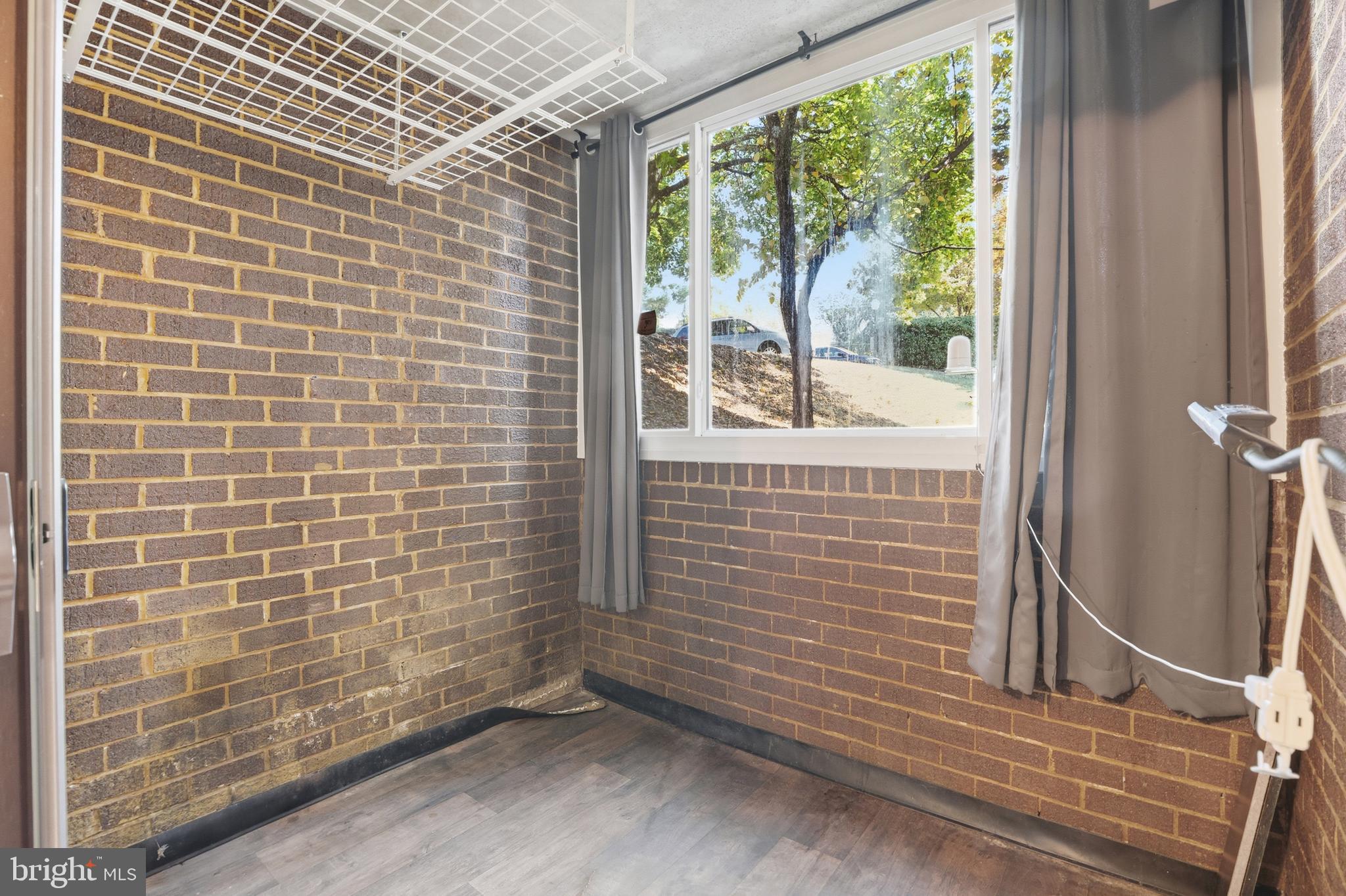 11242 Cherry Hill Road, Unit 1 Beltsville, MD 20705 - Photo 15 of 31 a view of a door and wooden floor