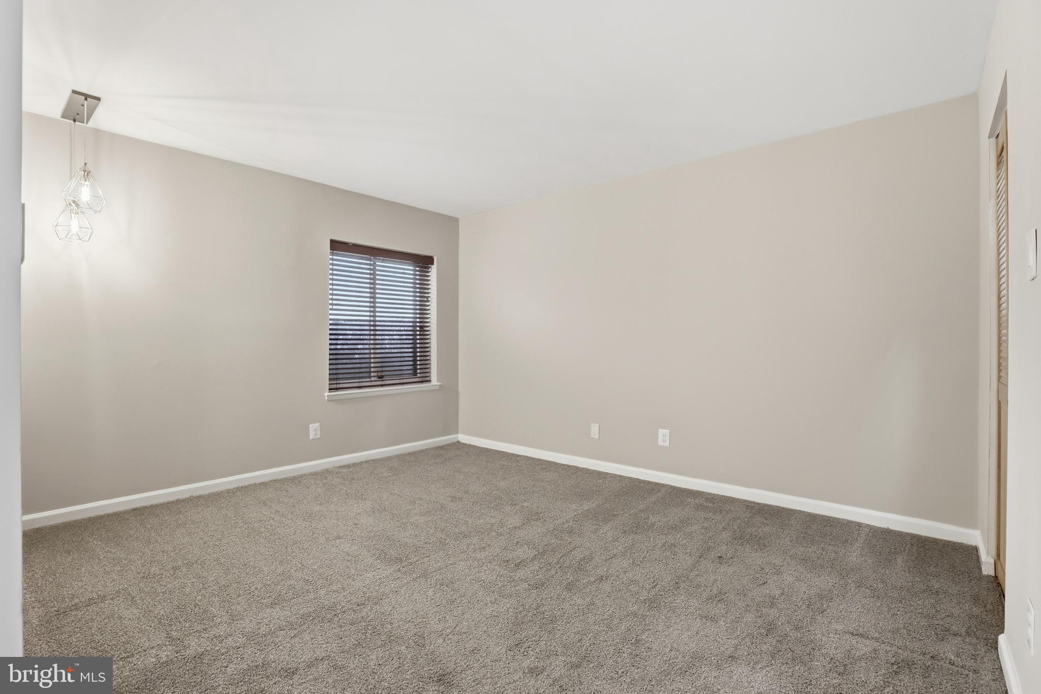 11242 Cherry Hill Road, Unit 1 Beltsville, MD 20705 - Photo 26 of 31 a view of an empty room with a window