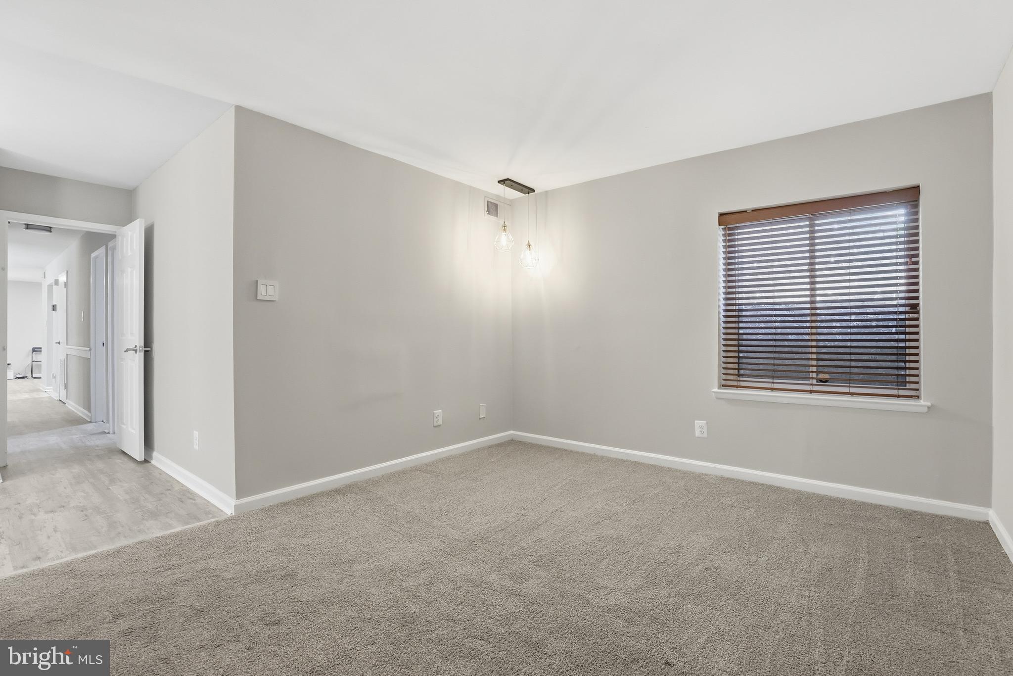 11242 Cherry Hill Road, Unit 1 Beltsville, MD 20705 - Photo 28 of 31 a view of an empty room with a window