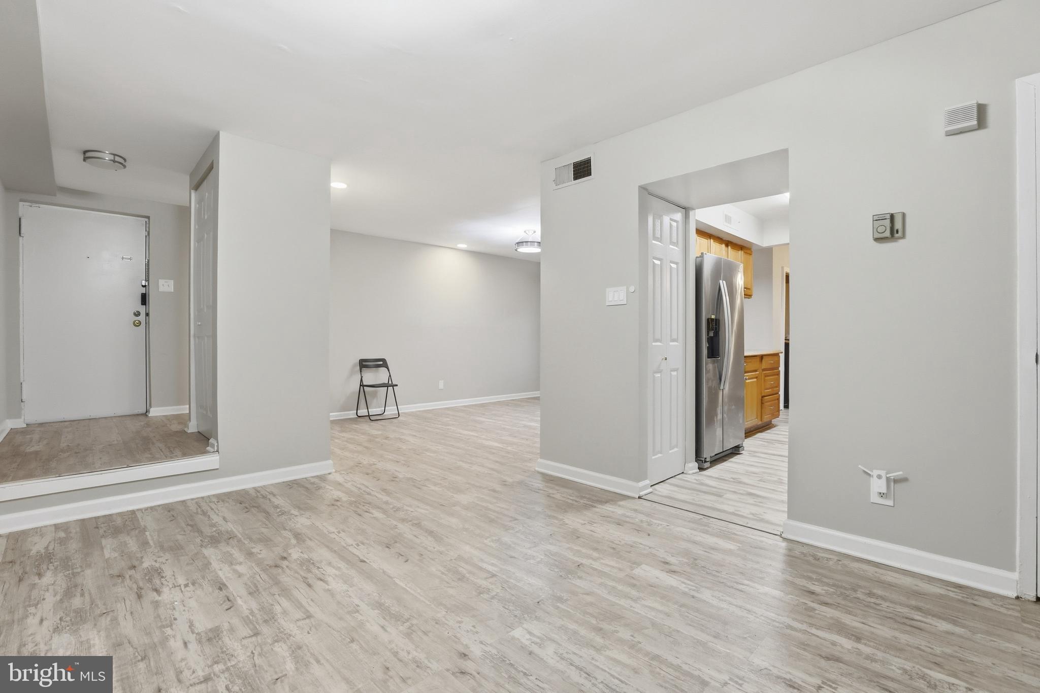 11242 Cherry Hill Road, Unit 1 Beltsville, MD 20705 - Photo 10 of 31 a view of a big room with wooden floor and a bathroom