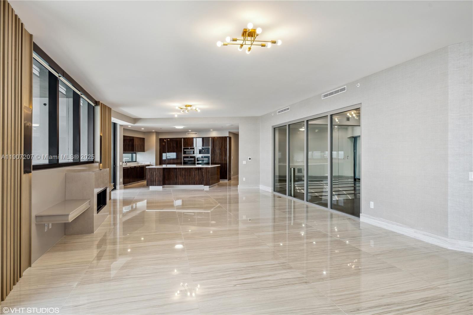 18555 Collins Avenue, Unit 1101 Sunny Isles Beach, FL 33160 - Photo 13 of 46 a view of an entryway with wooden floor