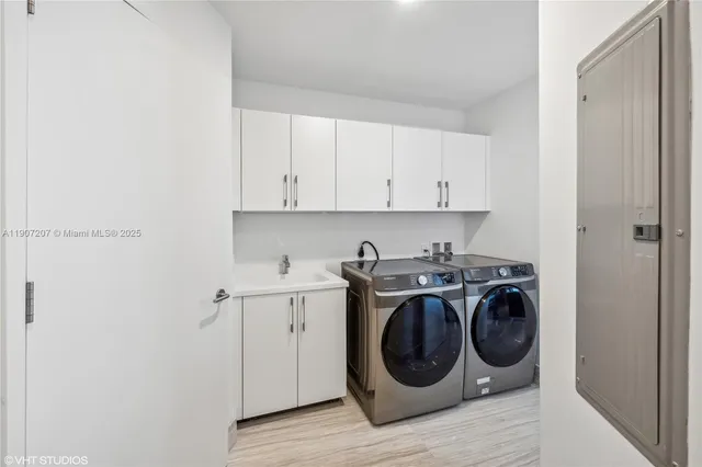 a utility room with dryer and washer