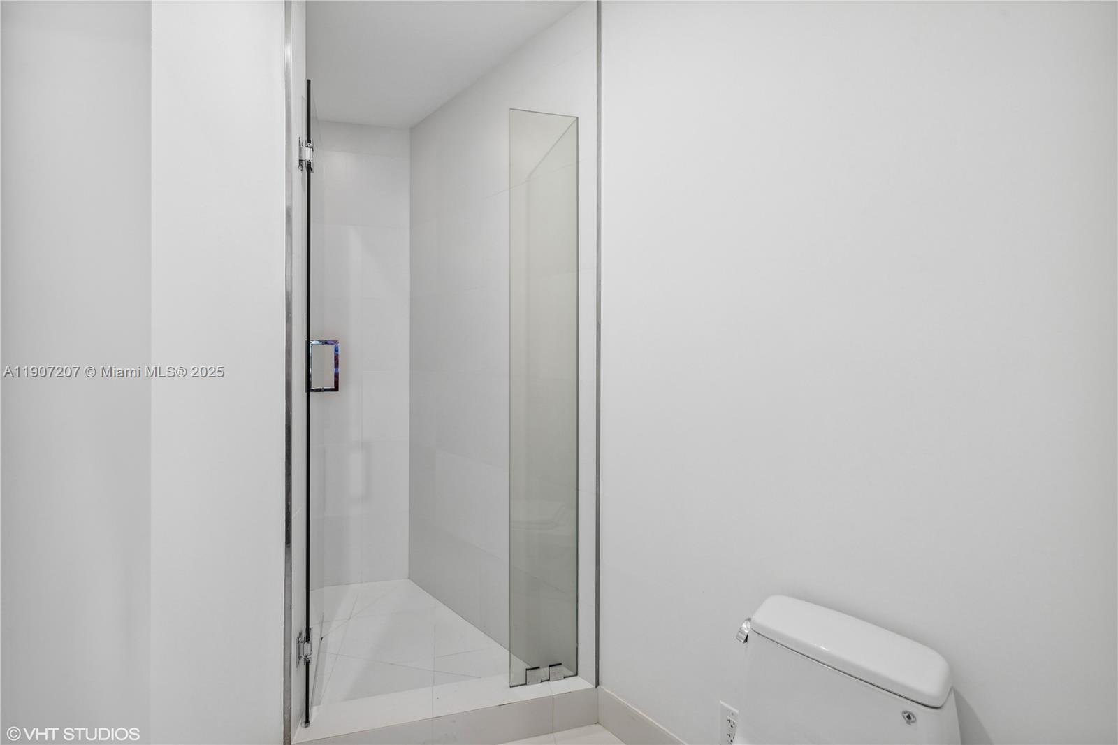 18555 Collins Avenue, Unit 1101 Sunny Isles Beach, FL 33160 - Photo 43 of 46 a bathroom with a shower