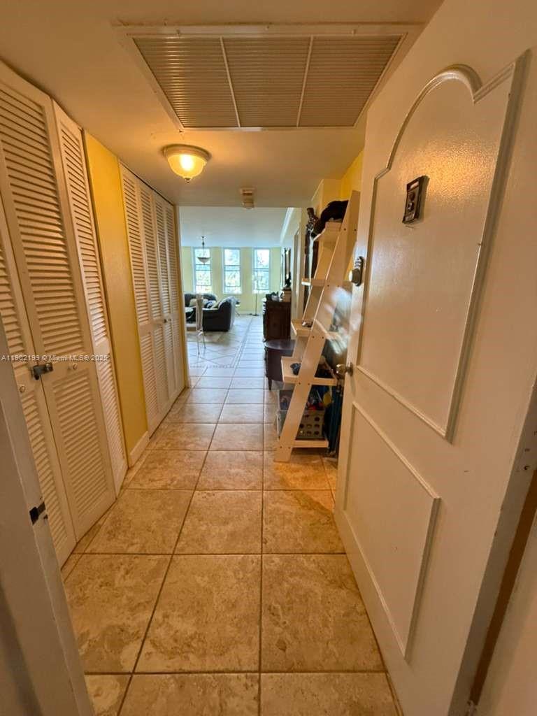 5401 Collins Avenue, Unit 131 Miami Beach, FL 33140 - Photo 15 of 33 a view of a hallway with furniture and a window