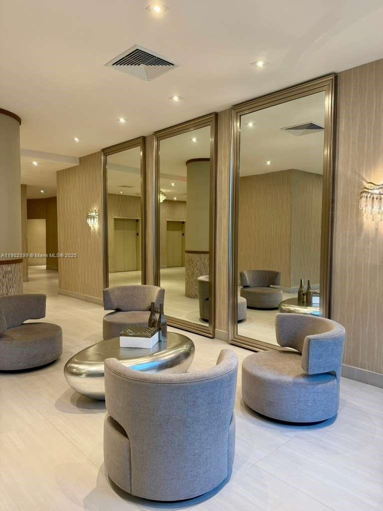 5401 Collins Avenue, Unit 131 Miami Beach, FL 33140 - Photo 18 of 33 a living room with furniture and a large window