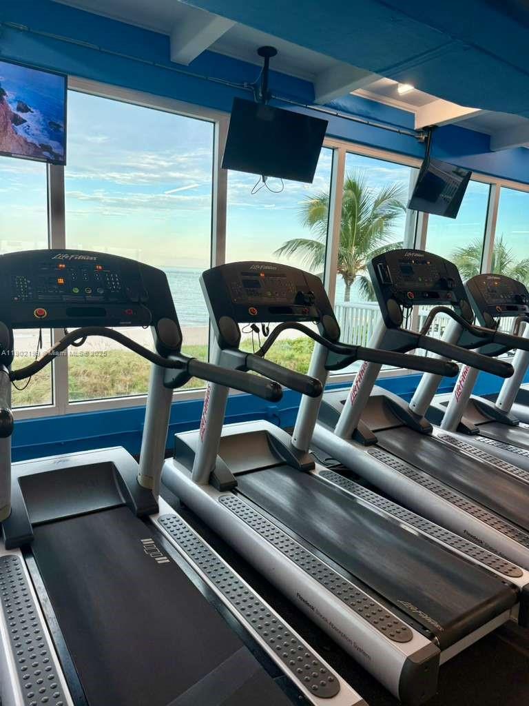5401 Collins Avenue, Unit 131 Miami Beach, FL 33140 - Photo 24 of 33 a view of a room with gym equipment