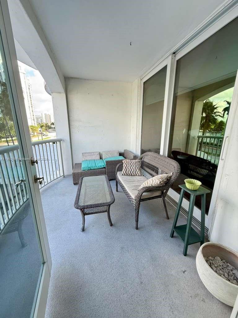 5401 Collins Avenue, Unit 131 Miami Beach, FL 33140 - Photo 3 of 33 a living room with furniture and a table