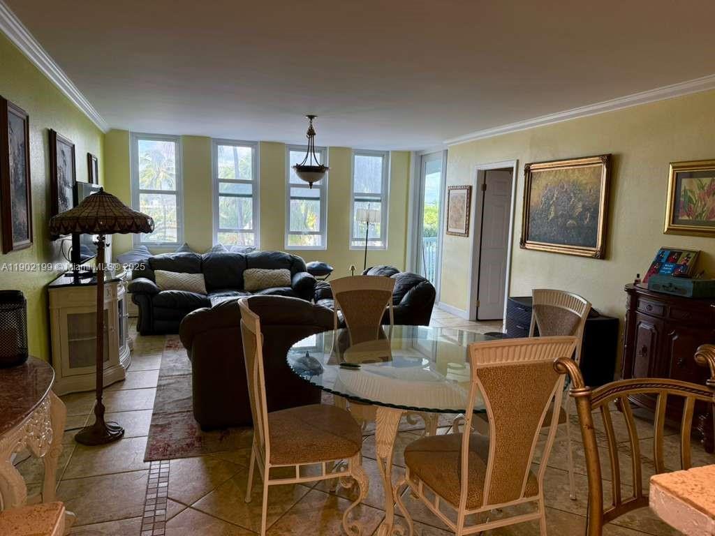 5401 Collins Avenue, Unit 131 Miami Beach, FL 33140 - Photo 8 of 33 a view of a dining room with furniture