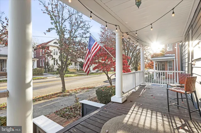 a view of a balcony with wooden floor