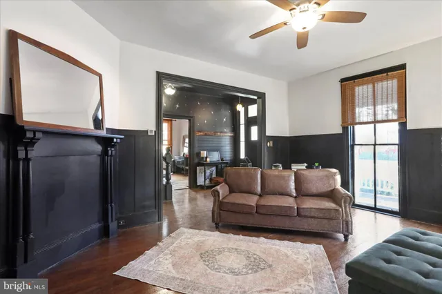 a dining room with furniture and wooden floor