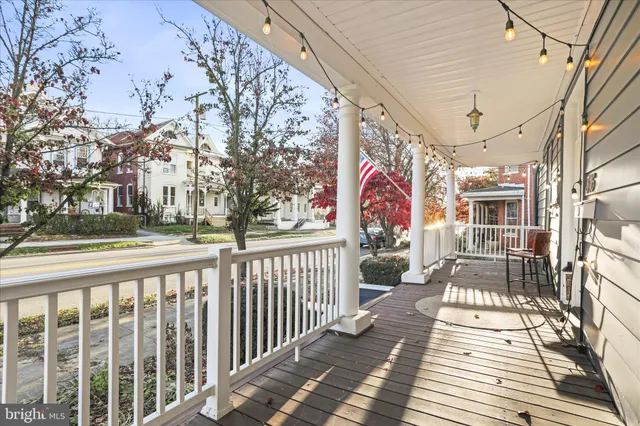 a dining room with a wooden table and chairs