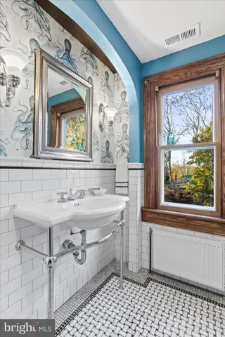 a view of a room with a table and chairs