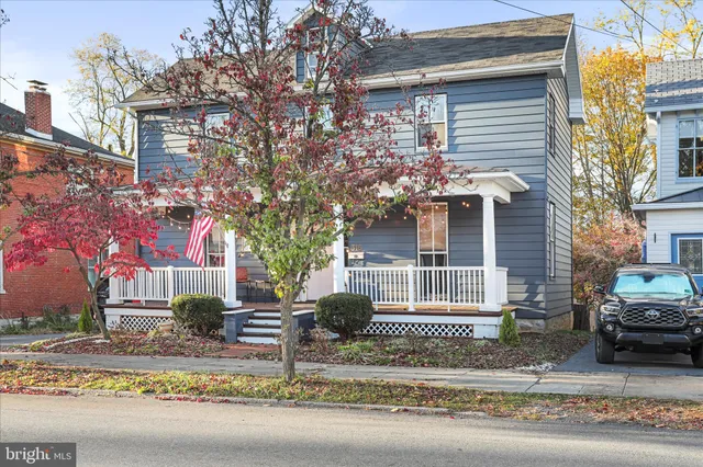 a front view of a house with street