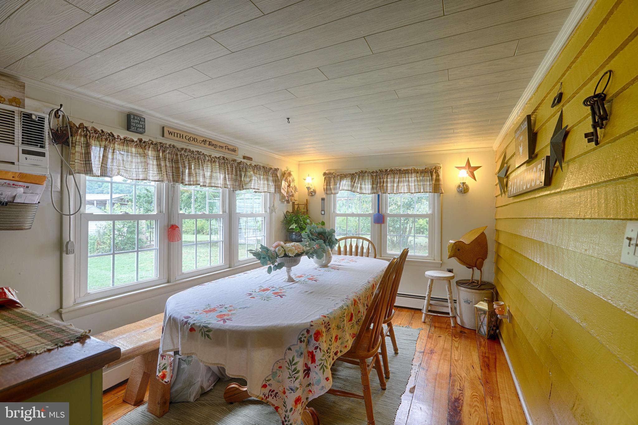 25439 Towers Road Denton, MD 21629 - Photo 18 of 40 a view of a dining room with furniture window and outside view