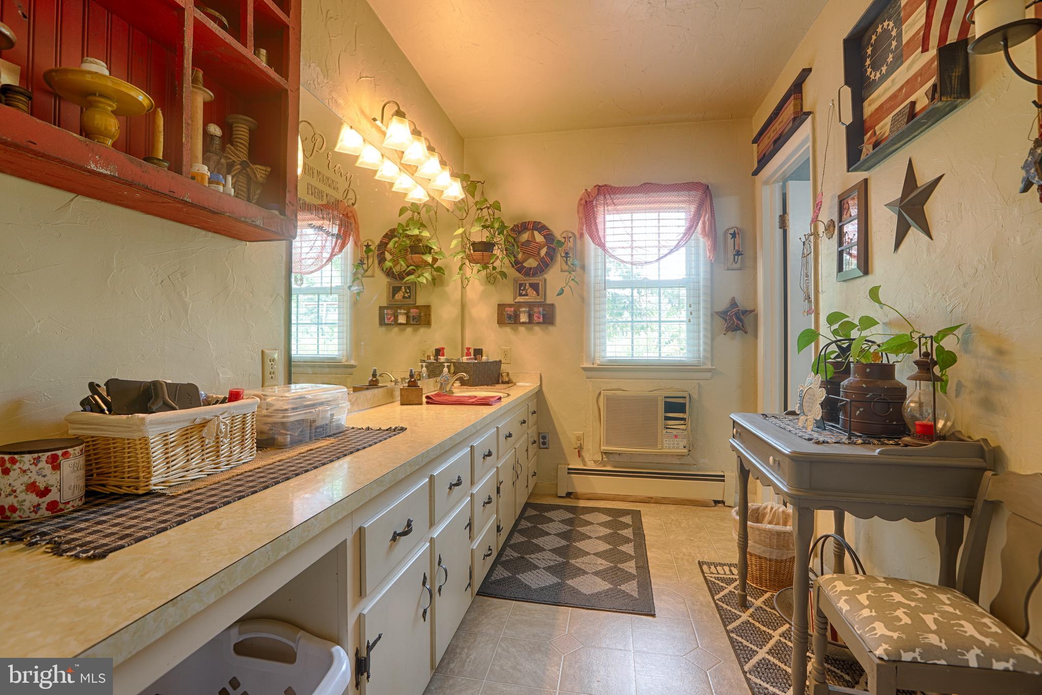 25439 Towers Road Denton, MD 21629 - Photo 34 of 40 a kitchen with stainless steel appliances a table and chairs in it