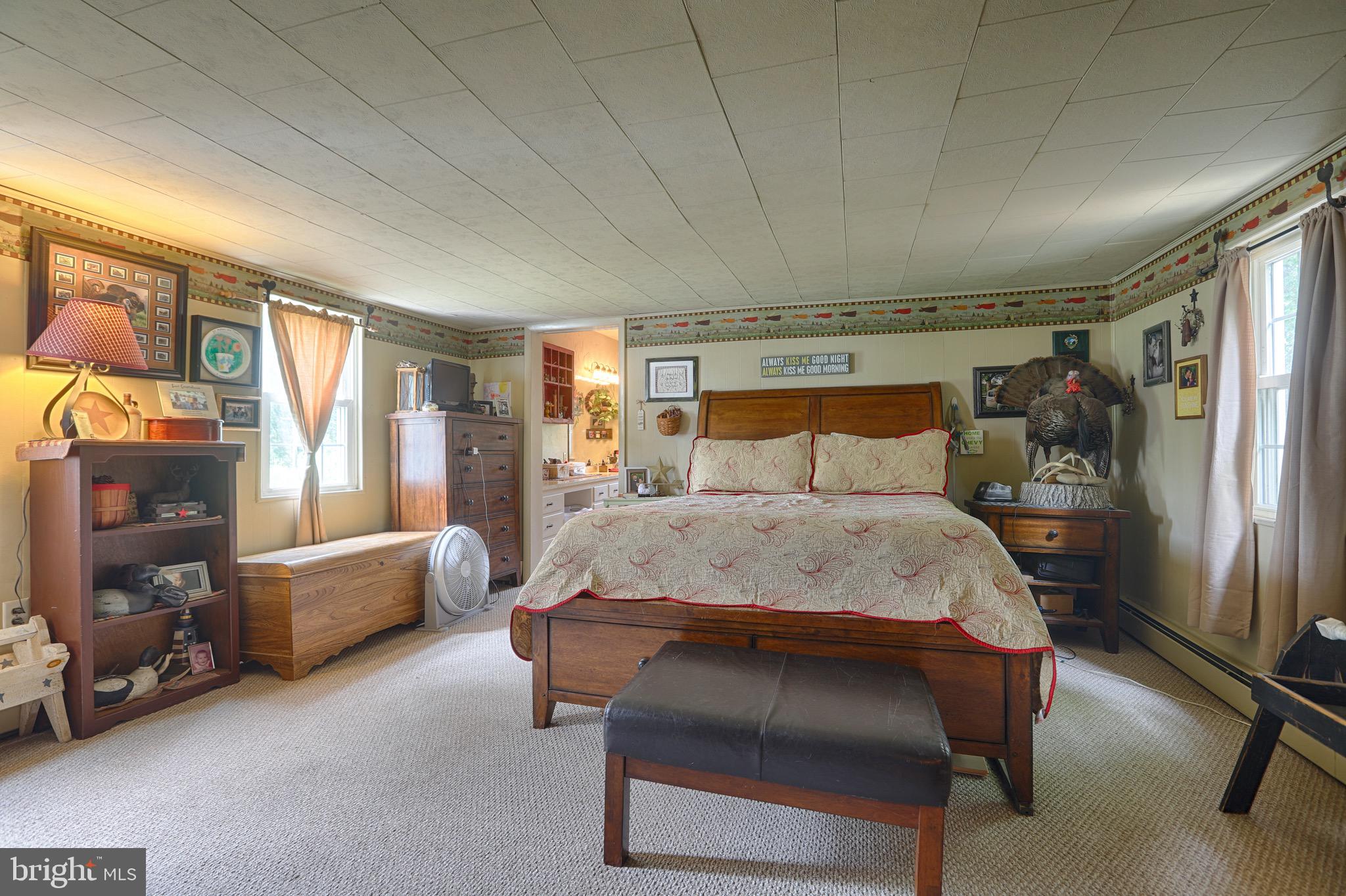 25439 Towers Road Denton, MD 21629 - Photo 37 of 40 a bed sitting in a room next to a window