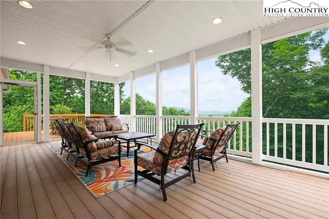 a view of a patio with wooden floor
