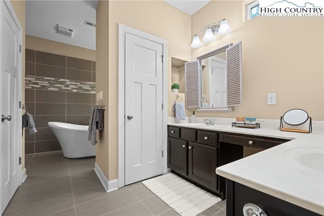 a kitchen with a sink and breakfast area