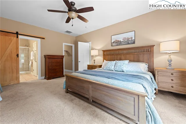 a bedroom with bed and window