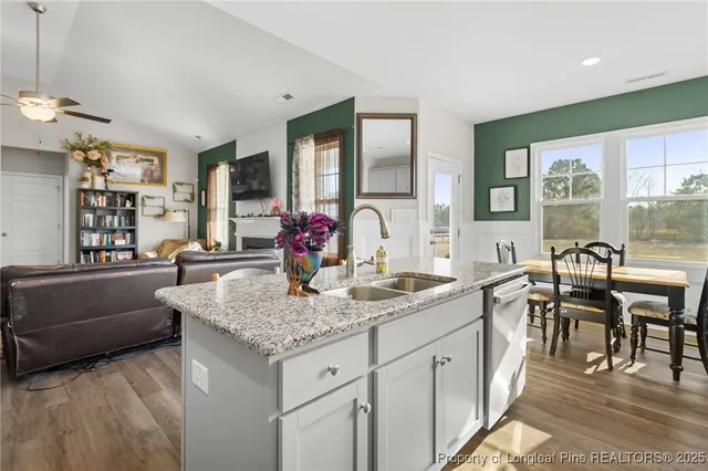 a view of a kitchen island granite countertop living room
