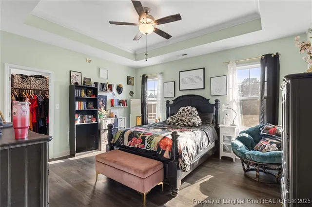 a bedroom with a bed furniture and a large closet