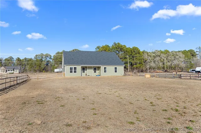 a picture of a bench in front of a wall