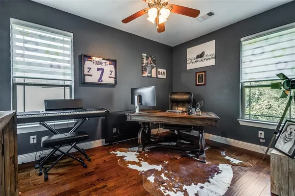 a workspace with furniture and a window