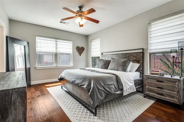 a bedroom with a large bed and a window
