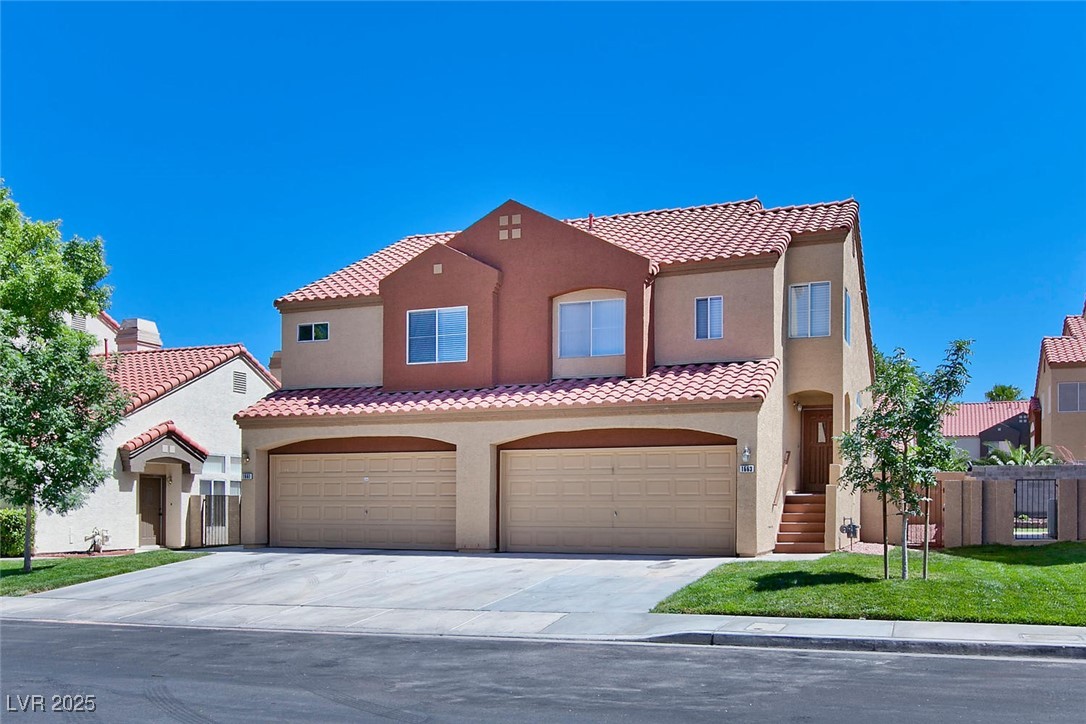 Mediterranean / spanish home with stucco siding, d