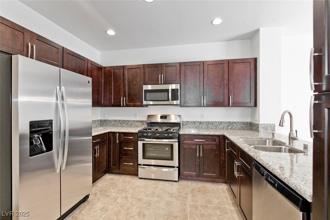 1663 Cloister Avenue Henderson, NV 89014 - Photo 12 of 35 Kitchen with stainless steel appliances, light sto