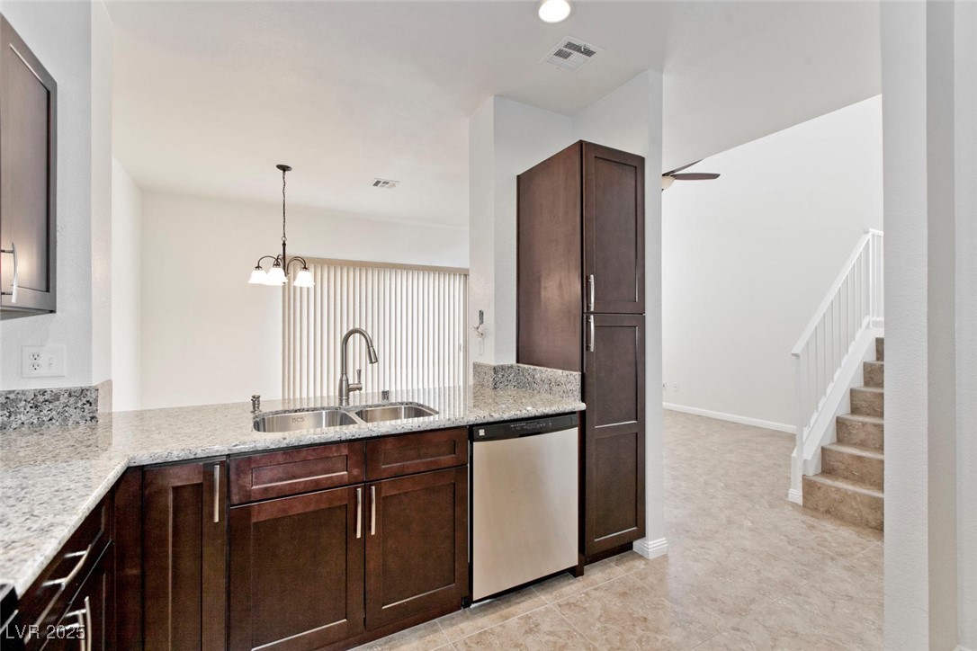 1663 Cloister Avenue Henderson, NV 89014 - Photo 13 of 35 Kitchen featuring dishwasher, dark brown cabinetry