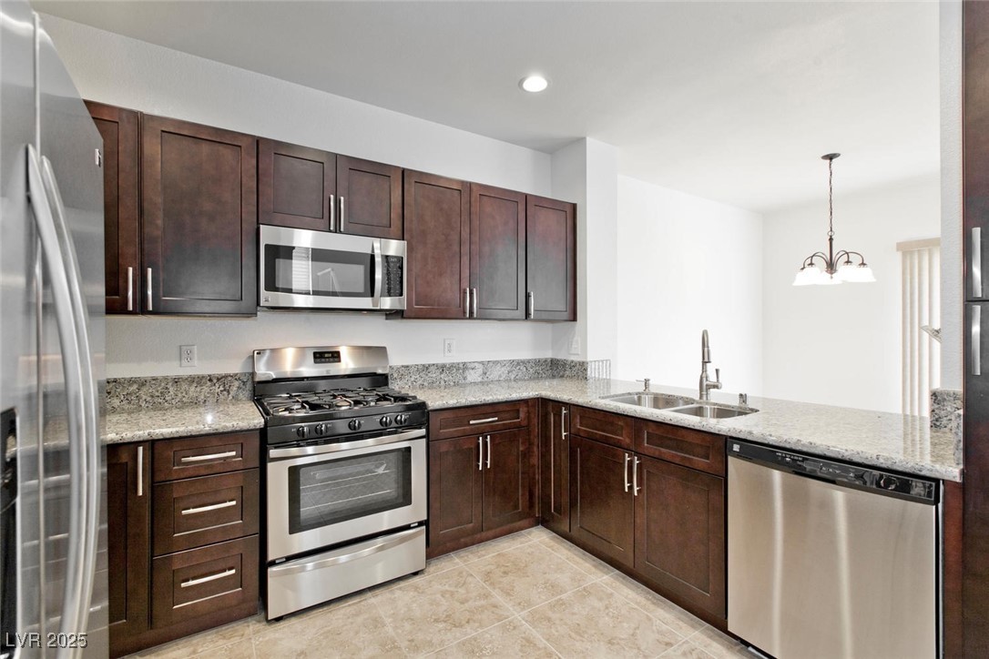 1663 Cloister Avenue Henderson, NV 89014 - Photo 14 of 35 Kitchen with stainless steel appliances, light til