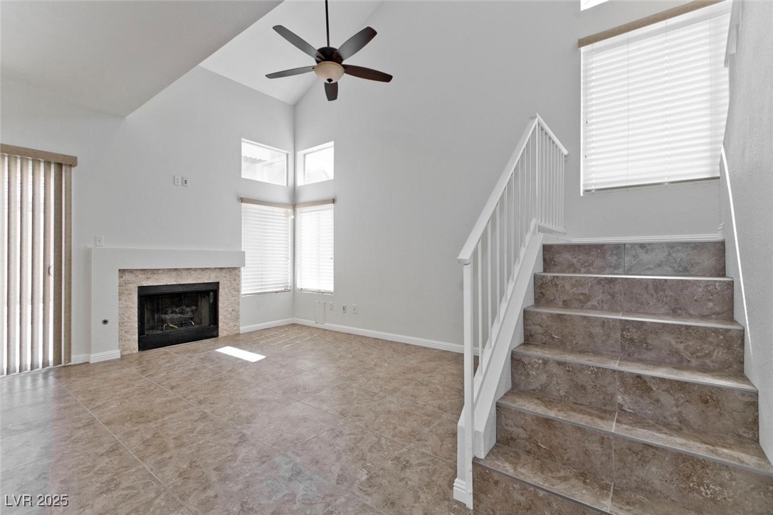 1663 Cloister Avenue Henderson, NV 89014 - Photo 16 of 35 Unfurnished living room featuring stairway, high v