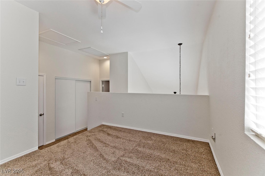 1663 Cloister Avenue Henderson, NV 89014 - Photo 20 of 35 Carpeted empty room featuring a ceiling fan and ba