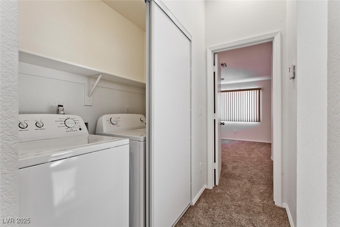 1663 Cloister Avenue Henderson, NV 89014 - Photo 22 of 35 Laundry area with carpet flooring and washing mach