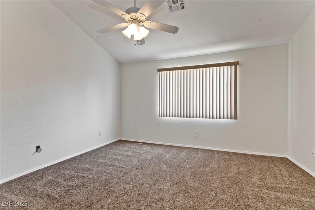 1663 Cloister Avenue Henderson, NV 89014 - Photo 23 of 35 Carpeted empty room with ceiling fan and lofted ce