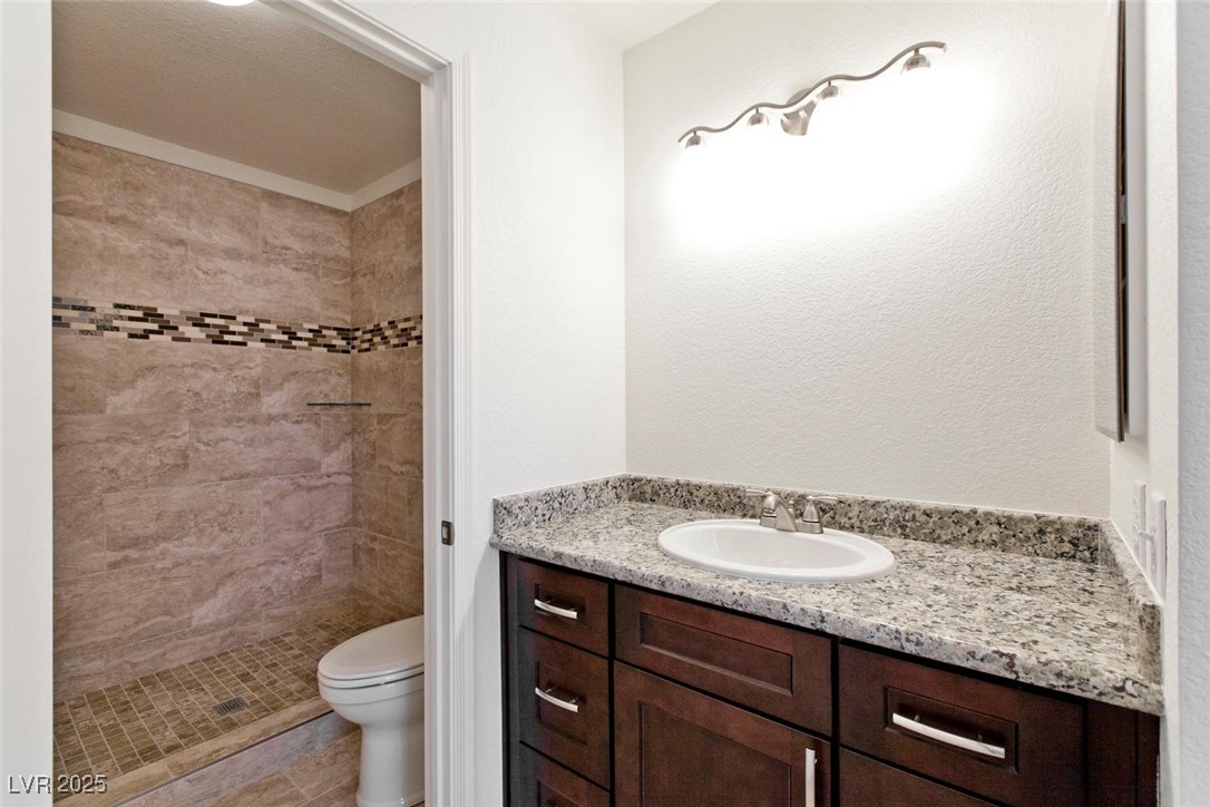 1663 Cloister Avenue Henderson, NV 89014 - Photo 26 of 35 Bathroom with a stall shower and vanity