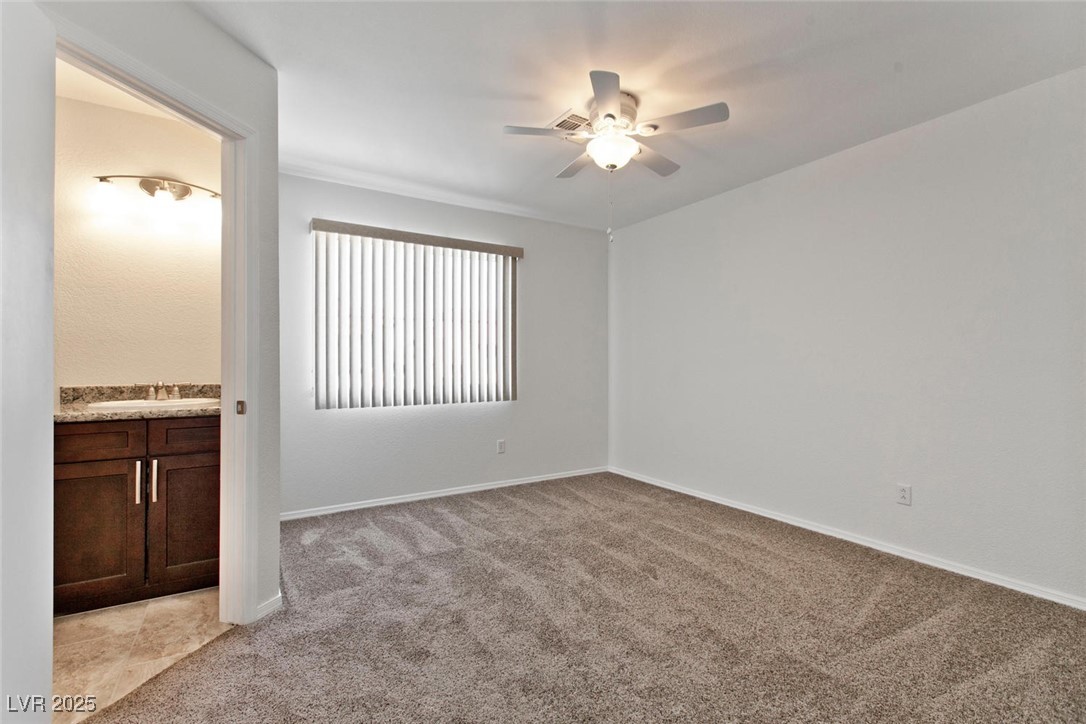 1663 Cloister Avenue Henderson, NV 89014 - Photo 28 of 35 Unfurnished room with a ceiling fan and light carp