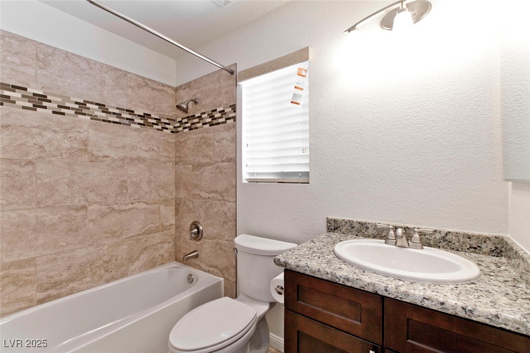 1663 Cloister Avenue Henderson, NV 89014 - Photo 30 of 35 Full bathroom featuring shower / washtub combinati