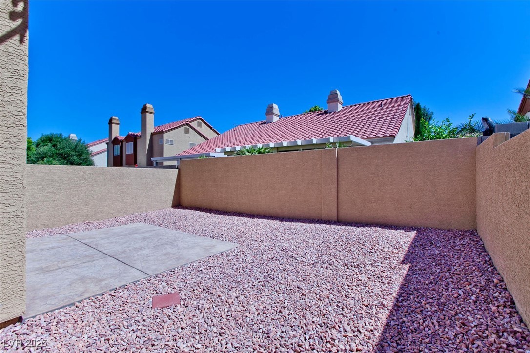 1663 Cloister Avenue Henderson, NV 89014 - Photo 33 of 35 Fenced backyard featuring a patio
