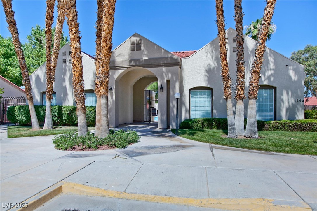 1663 Cloister Avenue Henderson, NV 89014 - Photo 34 of 35 View of front of property with stucco siding and a