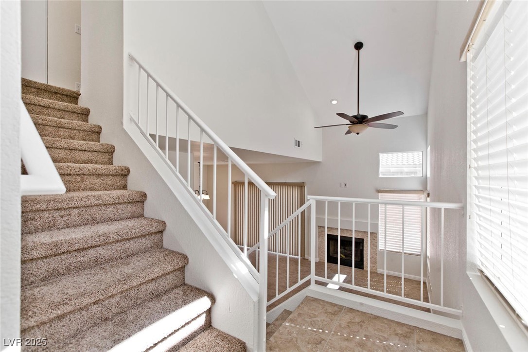 1663 Cloister Avenue Henderson, NV 89014 - Photo 4 of 35 Stairs with a ceiling fan and high vaulted ceiling